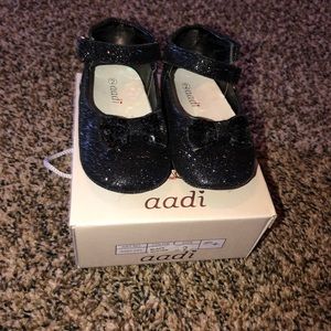 Black sparkly flats with band around ankle